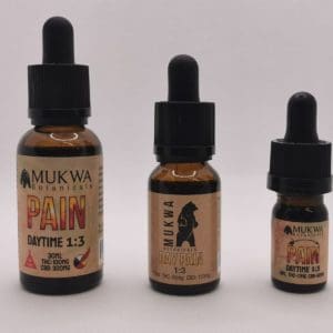 Three bottles of tinctures with different concentrations of CBD and THC, sold at Comfort Tree