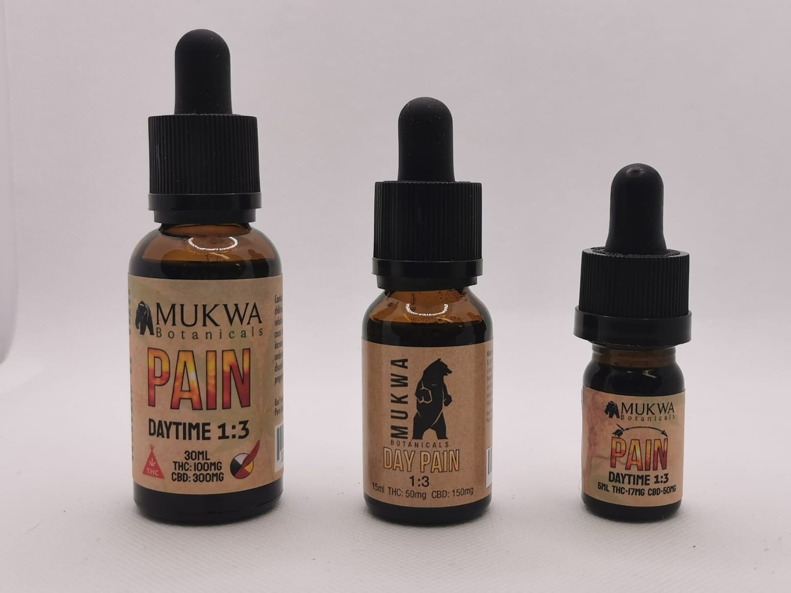 Mukwa Pain Daytime Tincture (30mL,15mL,5mL) Three bottles of tinctures with different concentrations of CBD and THC, sold at Comfort Tree