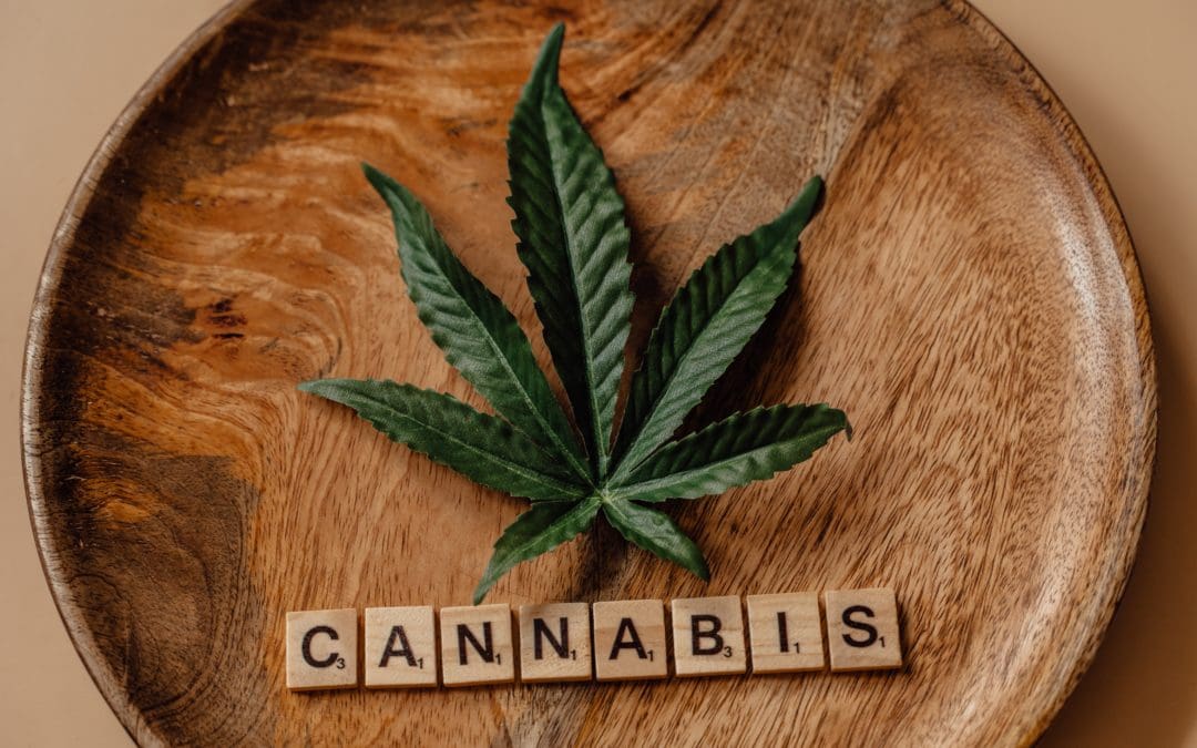 Cannabis leaf with cannabis spelled out in scrabble letters