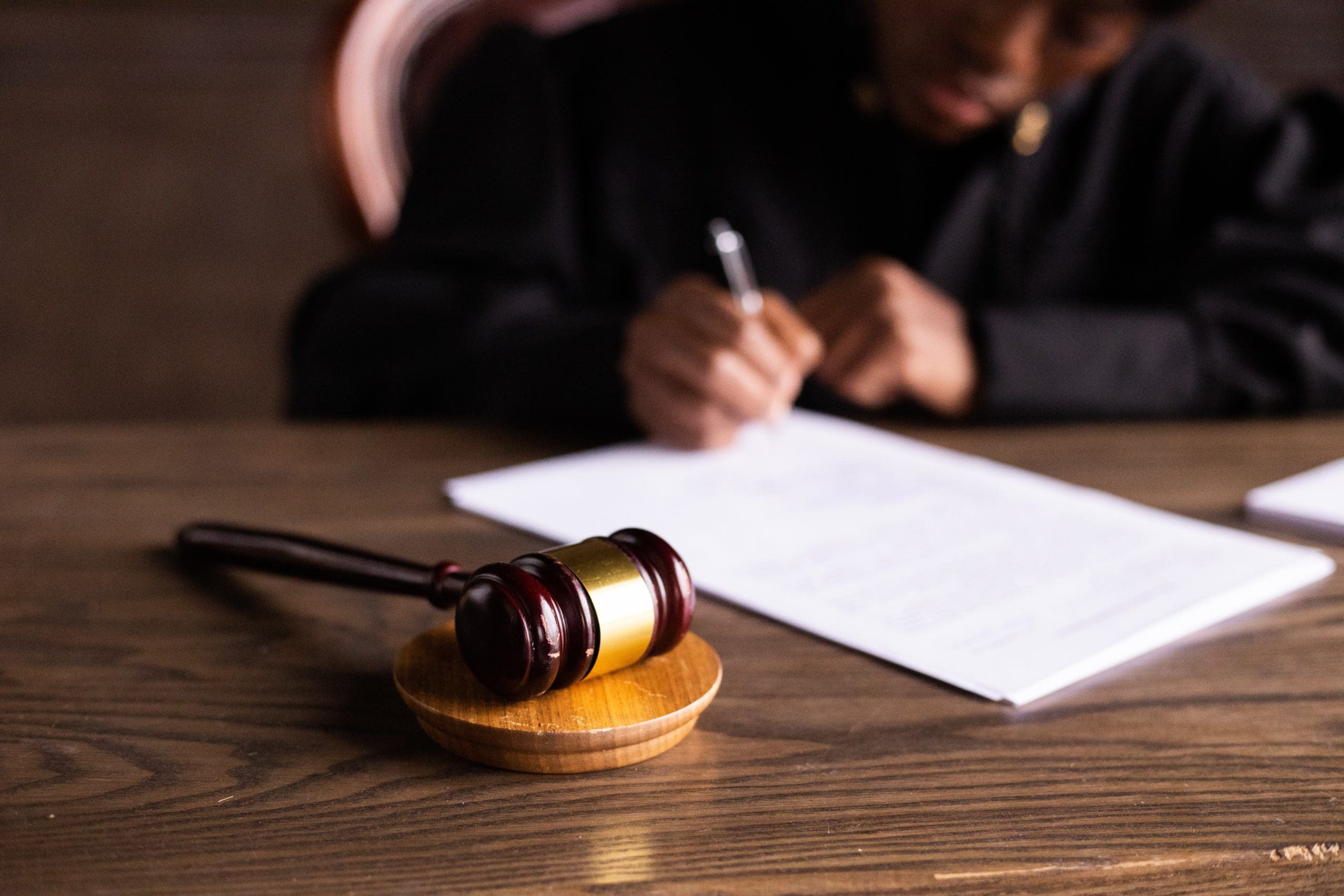 Gavel on a desk beside a judge