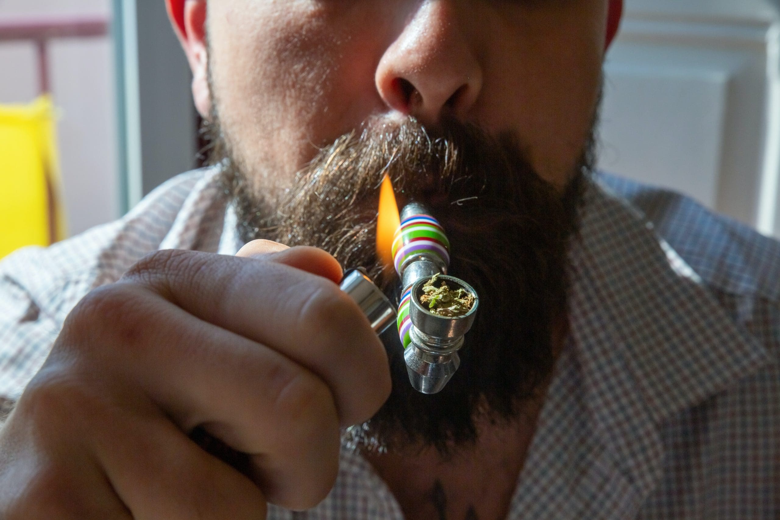 smoking-weed-pipe man smoking marijuana in a pipe