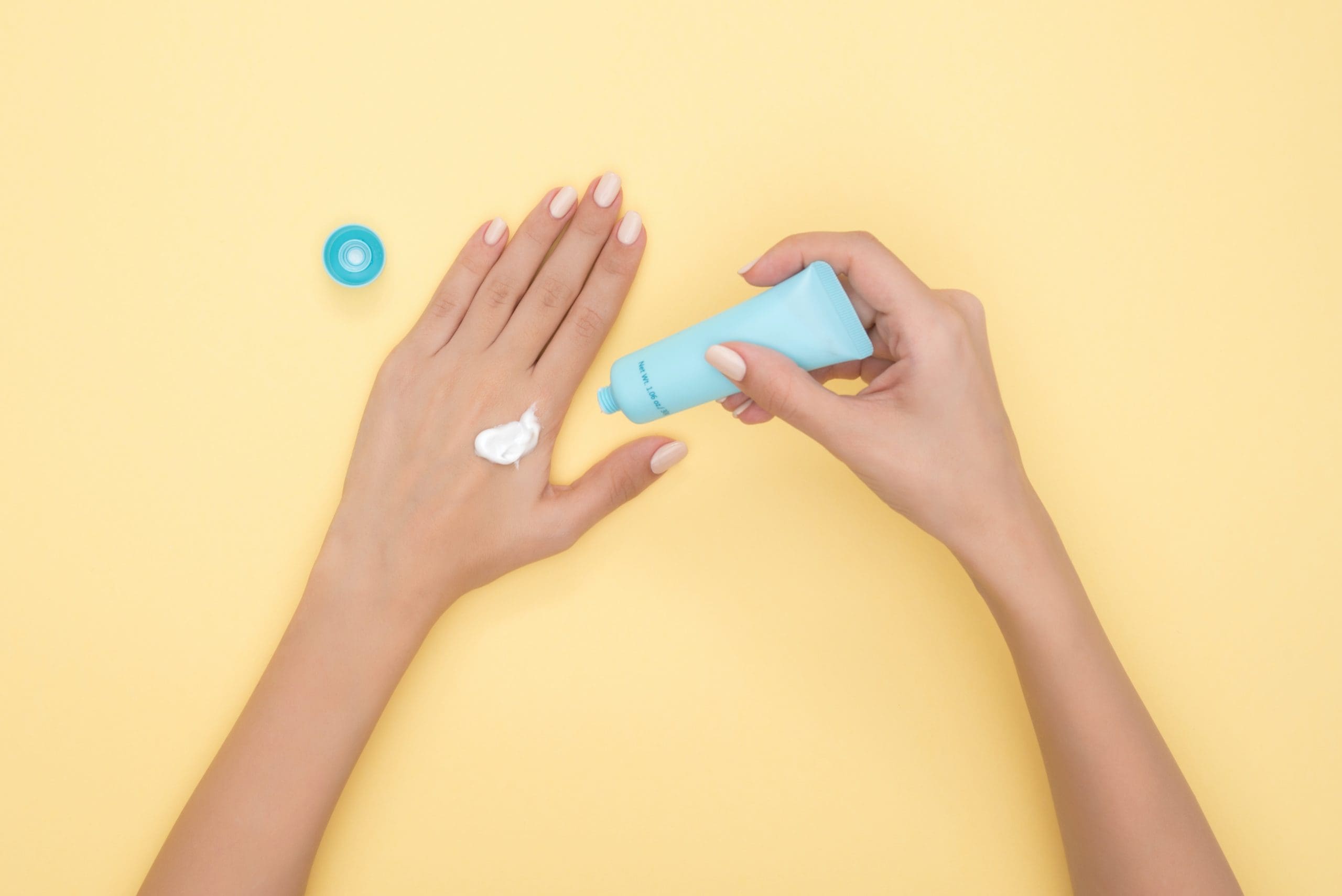 pexels-moose-photos-1029896 Hands putting on CBD lotion